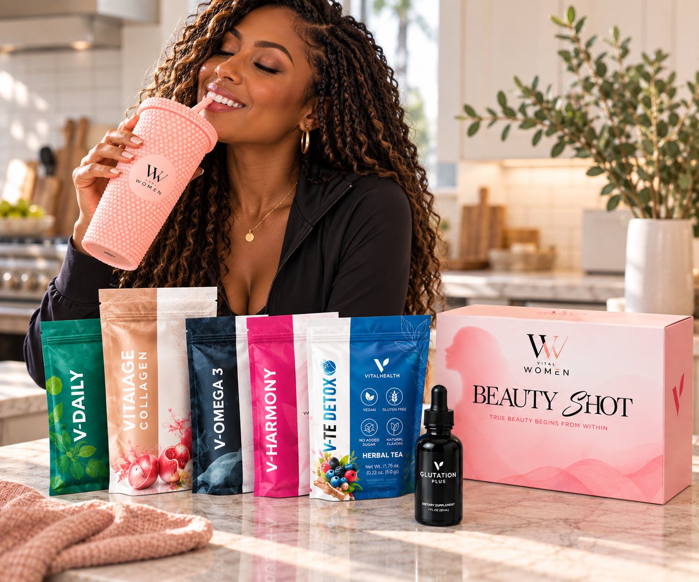 A woman sipping from a pink Vital Women tumbler beside V-Daily, VitaIAge Collagen, V-Omega 3, V-Harmony, V-Te Detox tea, Glutation Plus and a Beauty Shot box